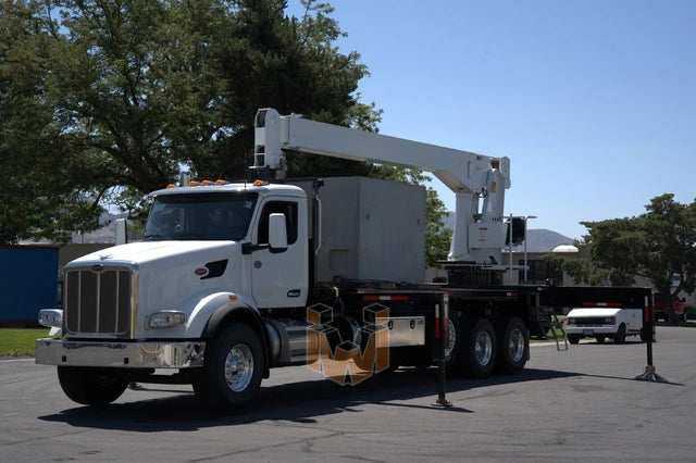 Peterbilt 567 truck with QMC 5037R Rear Mounted Boom Crane