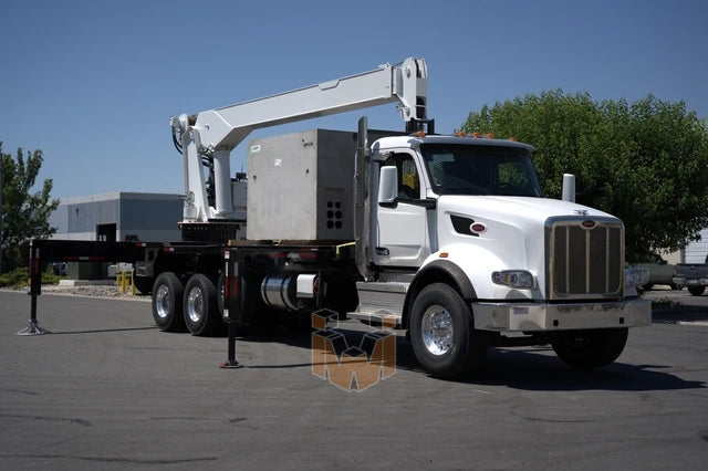 Peterbilt 567 truck with QMC 5037R Rear Mounted Boom Crane