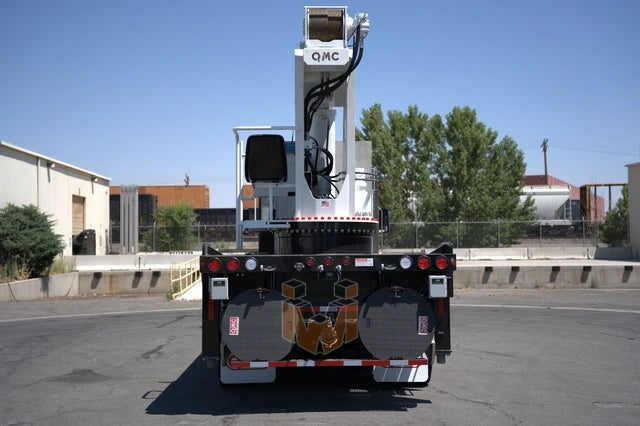 Peterbilt 567 truck with QMC 5037R Rear Mounted Boom Crane